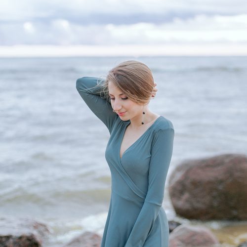Canva - Woman in Blue Dress Standing on Rock Near Sea
